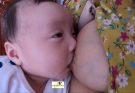 Breastfeeding and playing with baby Thinh