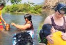The single mother went to the stream to catch snails