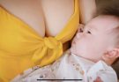 A mother lovingly breastfeeds her baby while traveling in a vehicle