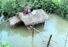 Rising floodwaters destroyed the small home of a single mother.